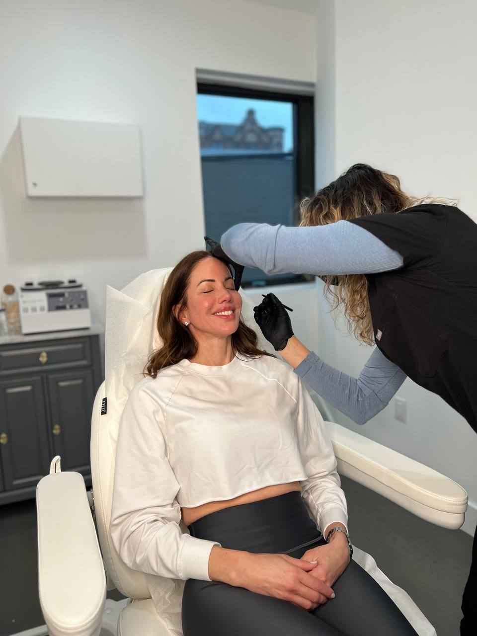Smiling Woman Having Skin Consultation with Aesthetician | Aspen Prime MedSpa in Hoboken, NJ