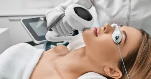 Woman receiving Lumecca facial treatment at a spa clinic in Hoboken, NJ